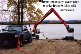 Image of an excavator working within the silt screen on a dry hydrant install