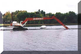 A photo of an excavator digging a dry hydrant trench.